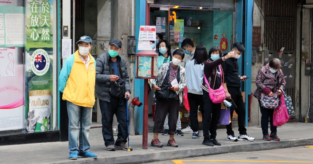 Macau citizens waiting for buses